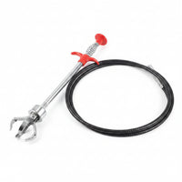 Flexible drain grabber claw reaching into a shower drain to remove a hair clog