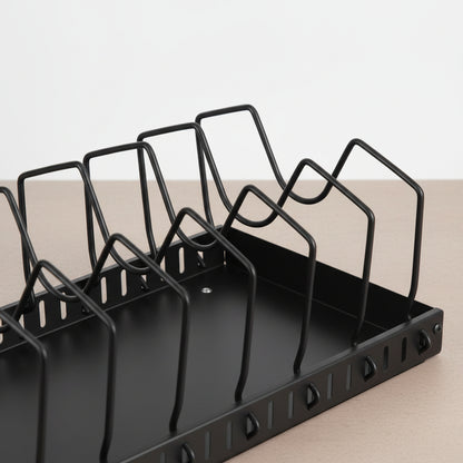 Under cabinet pot and pan organizer seated closed in the cabinet space holding pans