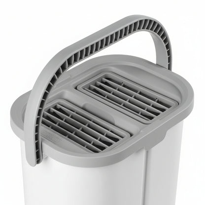 Dual chamber bucket lid showing separate wet and dry wringer plates with ridged scraper teeth